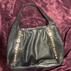 B Makowsky black leather purse with leopard interior.